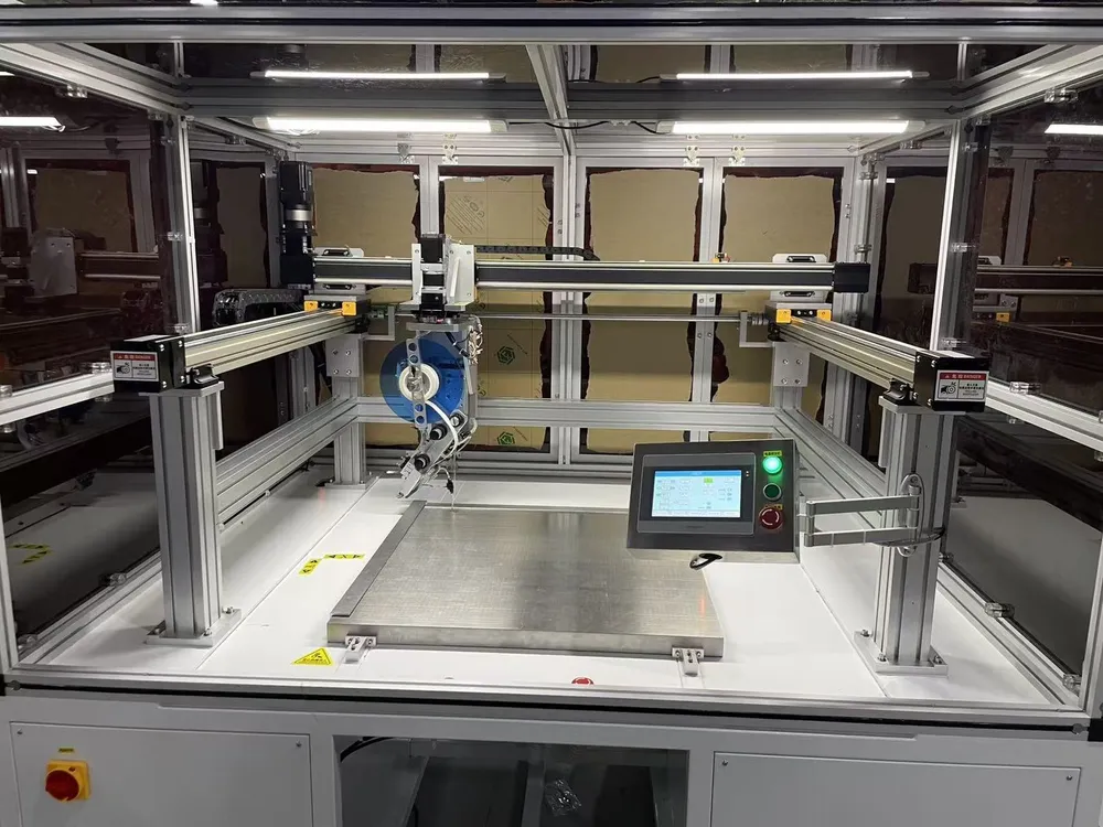 Floor-Standing 3-Axis Tape Applicator — Inside the enclosure: X, Y and Z axes above the work table
