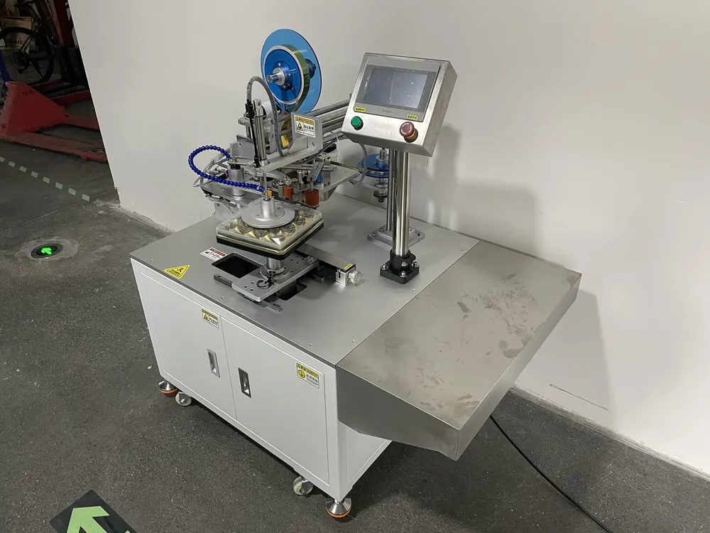 Square Box Tape Applicator — Box fixture, tape head and discharge chute