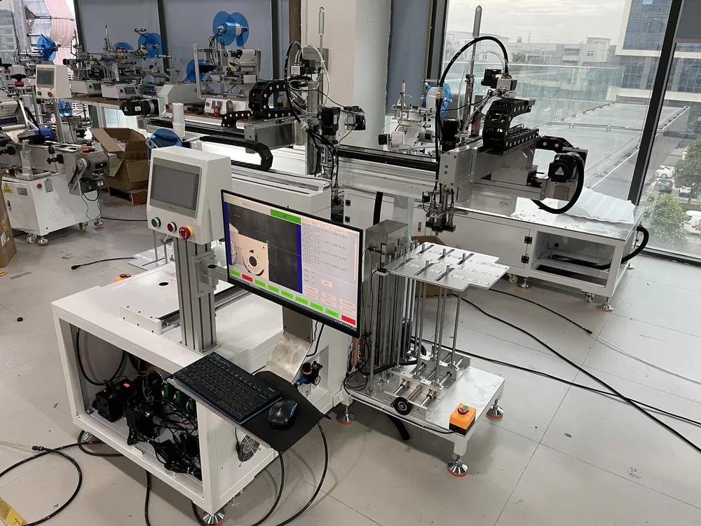Vision-Aligned Tape Applicator with Auto Loading & Unloading — Operator side: touchscreen, monitor and keyboard
