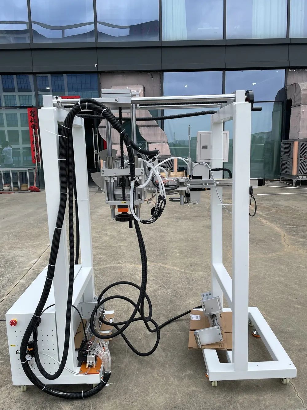 Gantry-Mounted Tape Applicator Head — Gantry with cable carriers and wiring