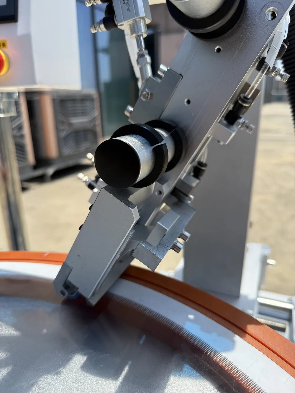 Rotary Tape Applicator for Washing-Machine Panels (T-803) — Tape head pressing tape onto the edge