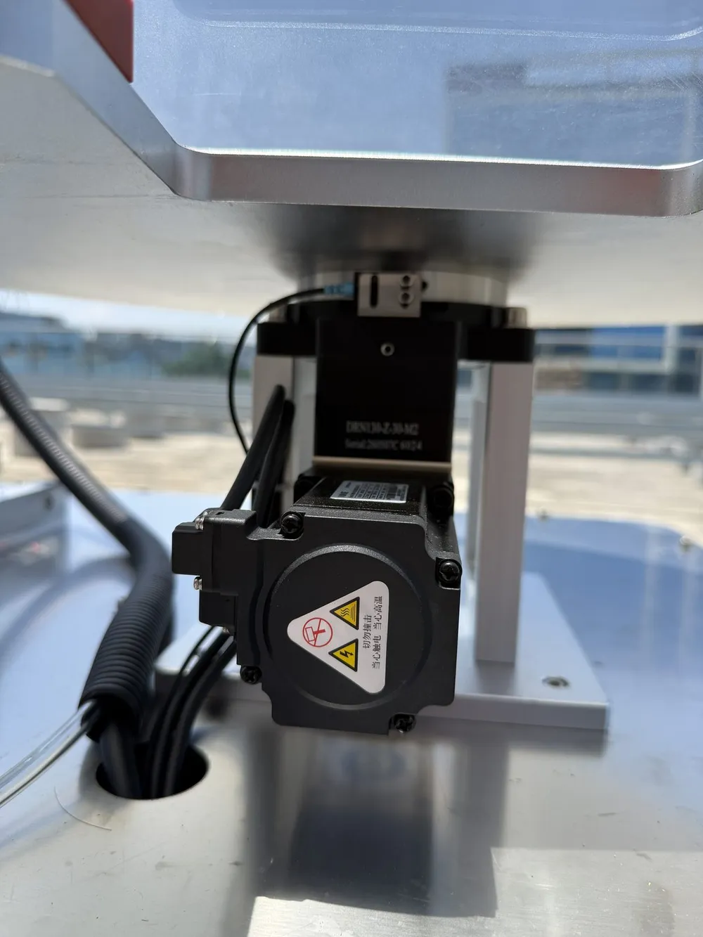 Rotary Tape Applicator for Washing-Machine Panels (T-803) — Turntable drive motor under the table