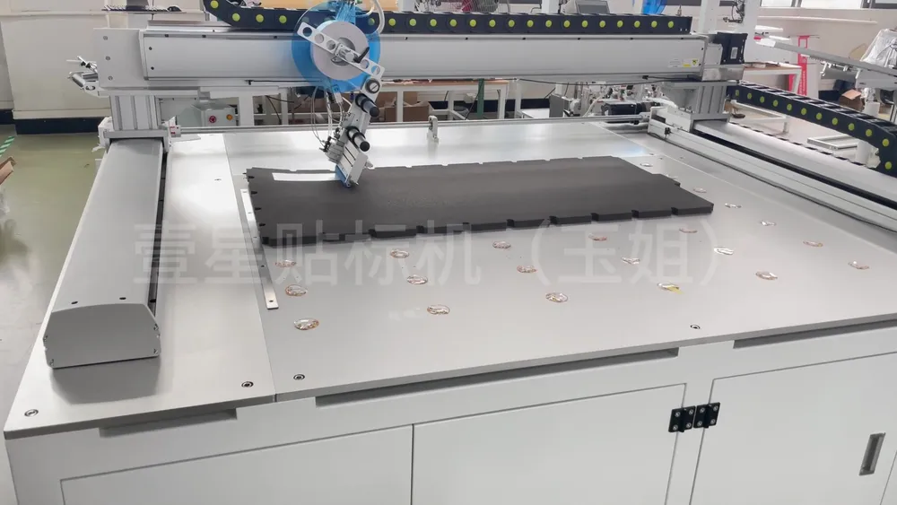 Floor-Standing 3-Axis Tape Applicator — Similar configuration — factory demo still