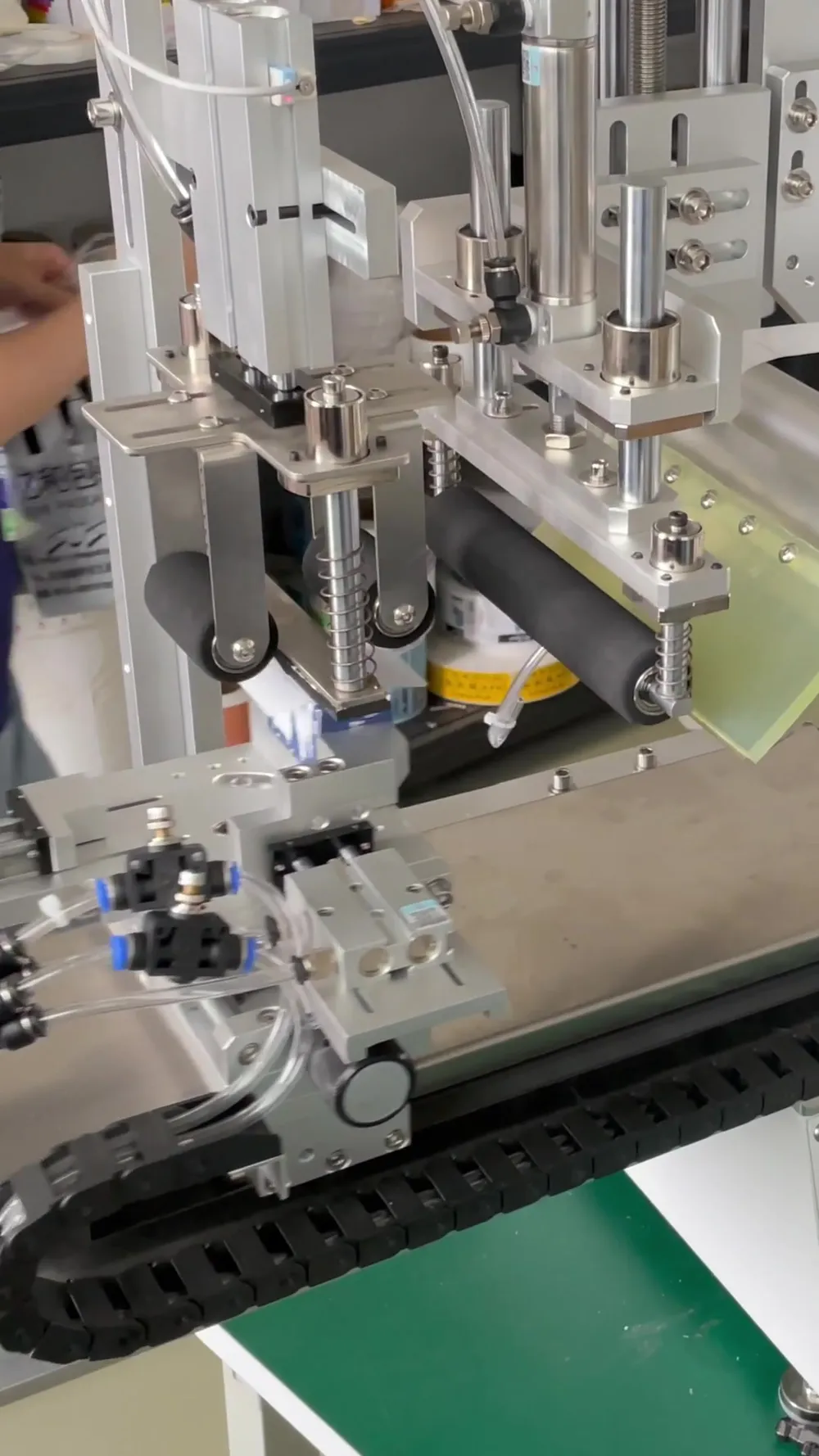 Semi-Automatic Roll-On + Rotary Multi-Face Labeling Machine — Similar configuration — factory demo still