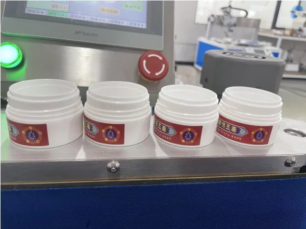 Automatic Roll-Rubbing Wrap-Around Labeling Machine — Plastic cream jars with labels