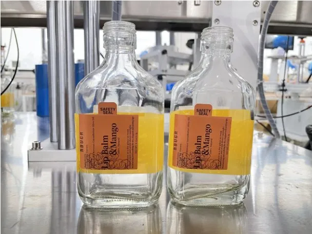 Automatic Three-Side Labeling Machine — Square glass bottles labeled on three faces