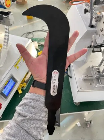 Semi-Automatic Flat Surface Labeling Machine — Irregular plastic part with a label