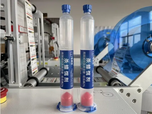 Semi-Automatic Round Bottle Labeling Machine — Transparent tubes with labels