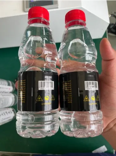 Semi-Automatic Roll-On + Rotary Multi-Face Labeling Machine — Round bottles with labels